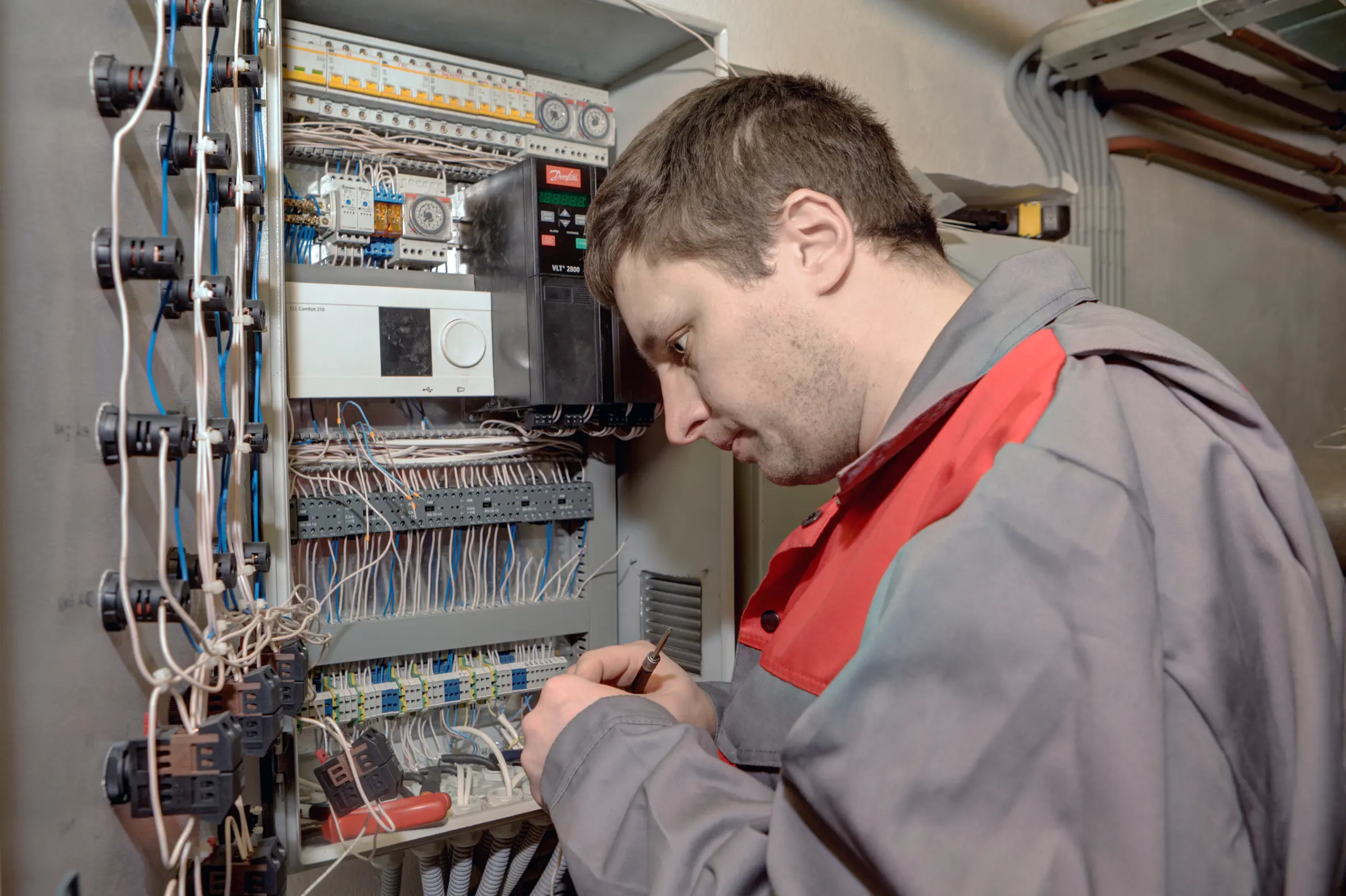 Licensed electrician and solar installer working on a desert home electrical system in Borrego Springs, CA
