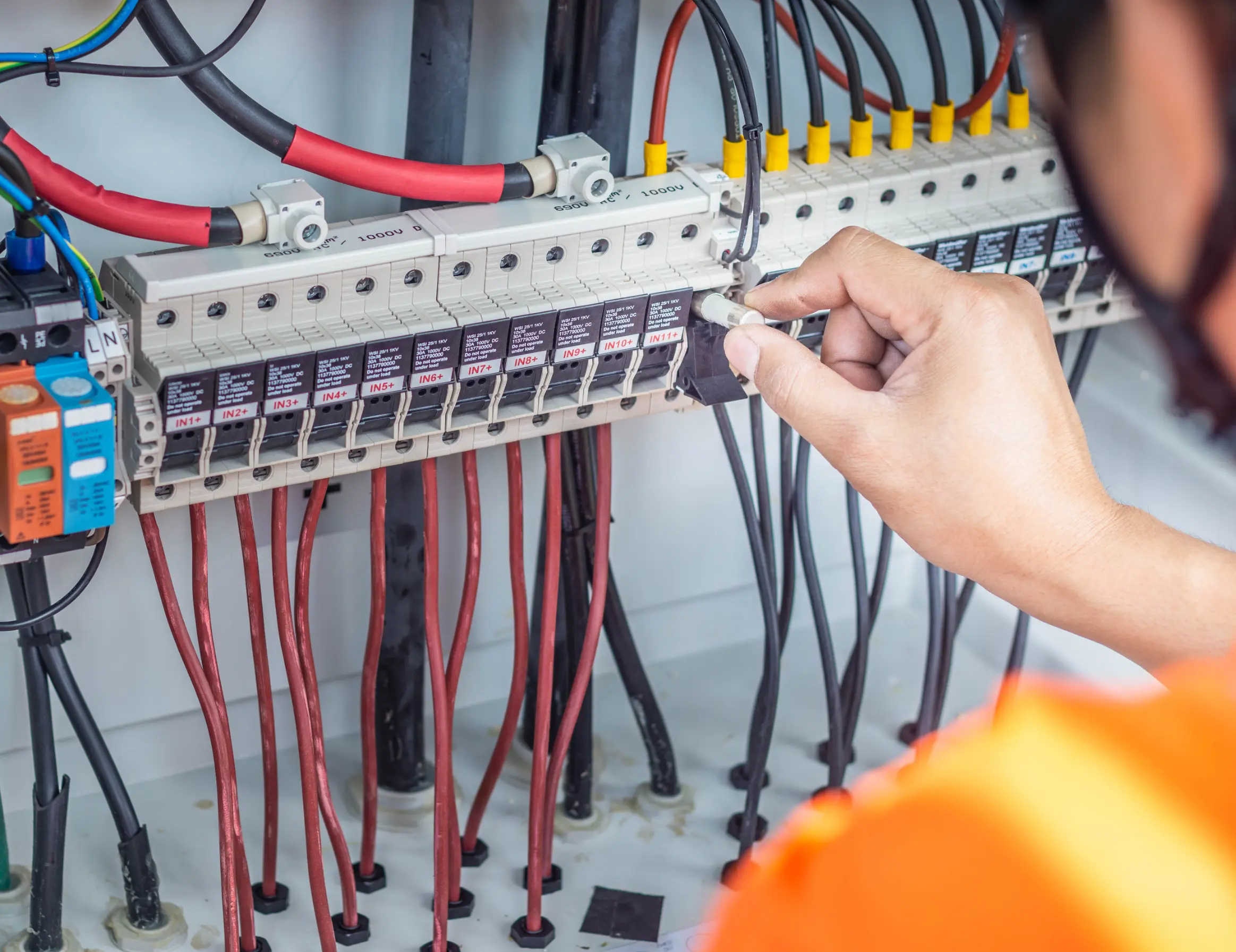 Licensed electrician and solar installer working on a mountain property near Julian, CA
